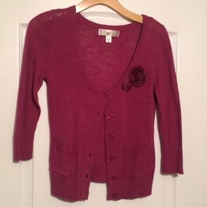 Maroon Cardigan with cute flower detail.
